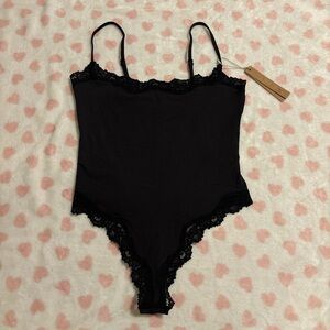 Skims fits everybody lace bodysuit black size small 
New with tag